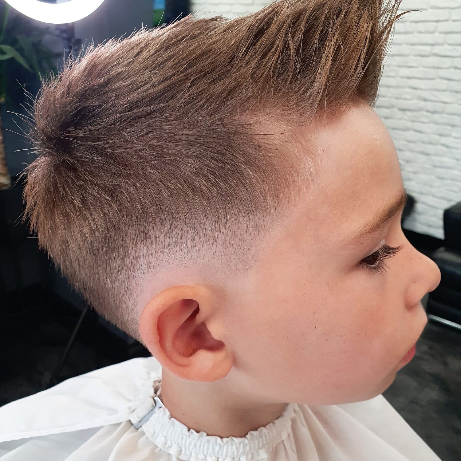 A boy’s textured cut with a fade