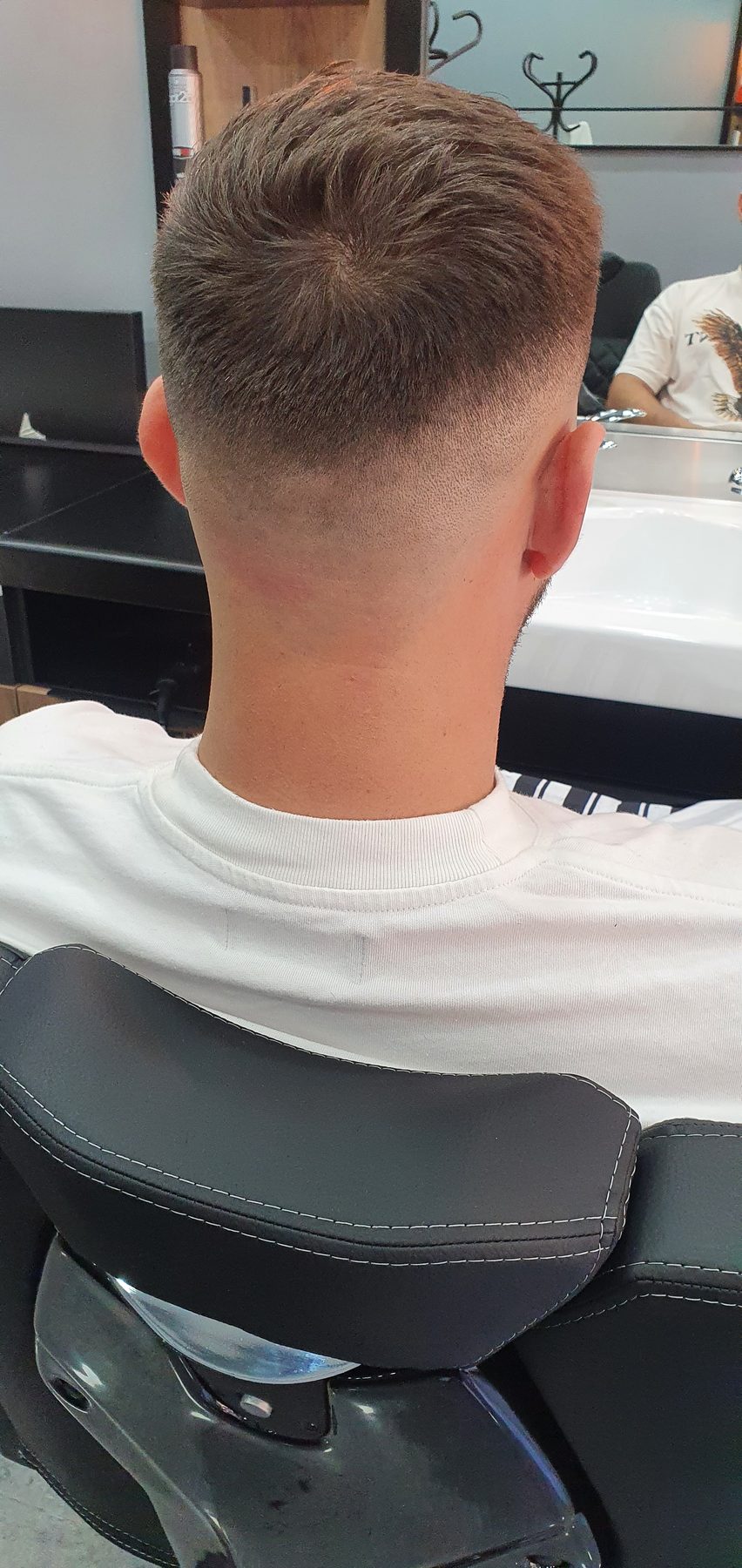 A mid fade seen from behind